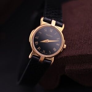 Vintage 1990s Gucci 3400L Women’s Watch
Swiss Made, 18k Gold-Plated, Black Dial